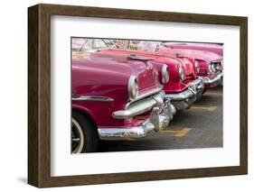 Red and pink vintage American car taxis on street in Havana, Cuba, West Indies, Central America-Ed Hasler-Framed Photographic Print