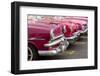 Red and pink vintage American car taxis on street in Havana, Cuba, West Indies, Central America-Ed Hasler-Framed Photographic Print