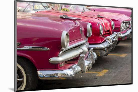 Red and pink vintage American car taxis on street in Havana, Cuba, West Indies, Central America-Ed Hasler-Mounted Photographic Print