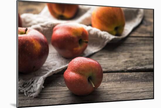 Red Apples and Towel on the Old Boards Horizontal-Denis Karpenkov-Mounted Photographic Print