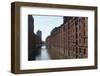 Red Brick Warehouses Overlook a Canal in the Speicherstadt District-Stuart Forster-Framed Photographic Print