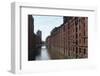 Red Brick Warehouses Overlook a Canal in the Speicherstadt District-Stuart Forster-Framed Photographic Print