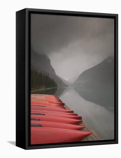 Red Canoes on Lake Louise, Banff National Park, Alberta, Canada-Walter Bibikow-Framed Stretched Canvas