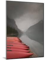 Red Canoes on Lake Louise, Banff National Park, Alberta, Canada-Walter Bibikow-Mounted Photographic Print