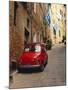 Red Car Parked in Narrow Street, Siena, Tuscany, Italy-Ruth Tomlinson-Mounted Premium Photographic Print