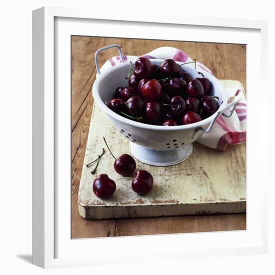 Red Cherries in a Colander on an Old Wooden Chopping Board-Michael Paul-Framed Photographic Print