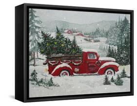 Red Christmas Truck Transports Christmas Trees through a Snowy Winter Landscape-Renate Holzner-Framed Stretched Canvas