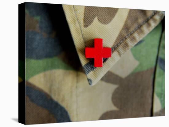 Red Cross on the Collar of a Camouflage Jacket-Winfred Evers-Stretched Canvas