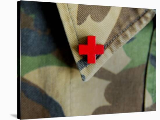 Red Cross on the Collar of a Camouflage Jacket-Winfred Evers-Stretched Canvas