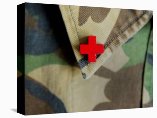 Red Cross on the Collar of a Camouflage Jacket-Winfred Evers-Stretched Canvas