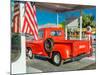 Red Dodge Pickup truck parked in front of vintage gas station in Santa Paula, California-null-Mounted Photographic Print