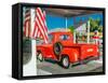 Red Dodge Pickup truck parked in front of vintage gas station in Santa Paula, California-null-Framed Stretched Canvas