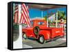 Red Dodge Pickup truck parked in front of vintage gas station in Santa Paula, California-null-Framed Stretched Canvas