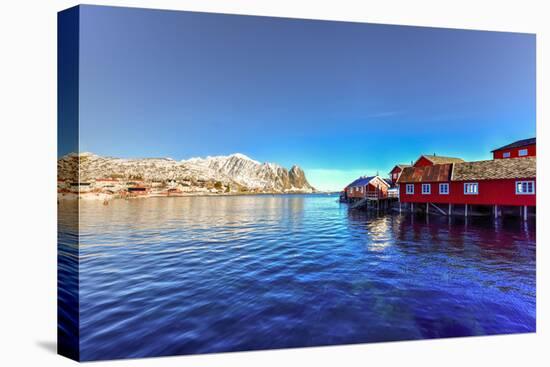 Red Fisherman House in Winter in Reine, Lofoten Islands, Norway-Felix Lipov-Stretched Canvas