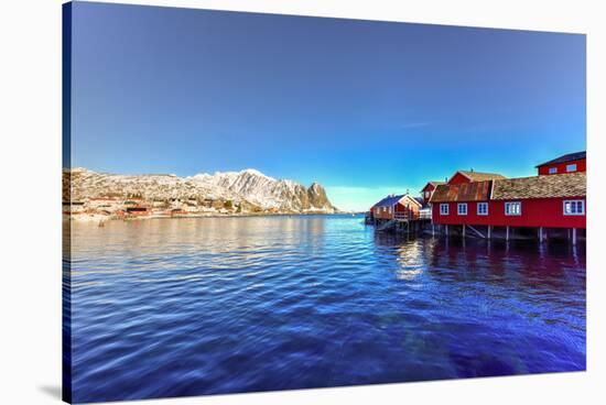 Red Fisherman House in Winter in Reine, Lofoten Islands, Norway-Felix Lipov-Stretched Canvas