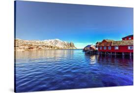 Red Fisherman House in Winter in Reine, Lofoten Islands, Norway-Felix Lipov-Stretched Canvas