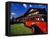 Red Jammer Buses Parked in Front of Glacier Park Lodge in East Glacier, Montana, USA-Chuck Haney-Framed Stretched Canvas