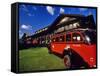 Red Jammer Buses Parked in Front of Glacier Park Lodge in East Glacier, Montana, USA-Chuck Haney-Framed Stretched Canvas