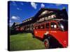 Red Jammer Buses Parked in Front of Glacier Park Lodge in East Glacier, Montana, USA-Chuck Haney-Stretched Canvas