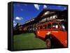 Red Jammer Buses Parked Outside of Glacier Park Lodge, Montana, USA-Chuck Haney-Framed Stretched Canvas