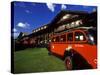 Red Jammer Buses Parked Outside of Glacier Park Lodge, Montana, USA-Chuck Haney-Stretched Canvas