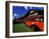 Red Jammer Buses Parked Outside of Glacier Park Lodge, Montana, USA-Chuck Haney-Framed Photographic Print