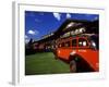 Red Jammer Buses Parked Outside of Glacier Park Lodge, Montana, USA-Chuck Haney-Framed Photographic Print