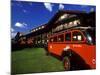 Red Jammer Buses Parked Outside of Glacier Park Lodge, Montana, USA-Chuck Haney-Mounted Photographic Print