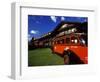 Red Jammer Buses Parked Outside of Glacier Park Lodge, Montana, USA-Chuck Haney-Framed Photographic Print