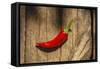 Red Pepper on Wooden Table, Yesemek, Gaziantep, Turkey-Ali Kabas-Framed Stretched Canvas