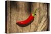 Red Pepper on Wooden Table, Yesemek, Gaziantep, Turkey-Ali Kabas-Stretched Canvas