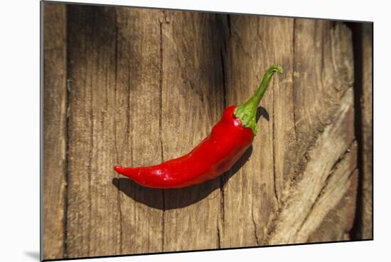 Red Pepper on Wooden Table, Yesemek, Gaziantep, Turkey-Ali Kabas-Mounted Photographic Print