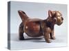 Red Pottery Statue Depicting a Dog Wearing a Mask-null-Stretched Canvas