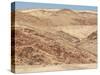 Red Rocky Landscape with Jeep in Distance, Purros Conservancy Wilderness, Kaokoland, Namibia-Kim Walker-Stretched Canvas