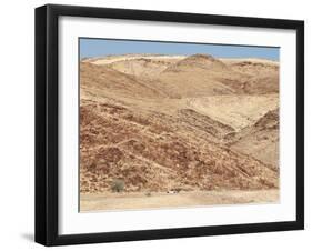 Red Rocky Landscape with Jeep in Distance, Purros Conservancy Wilderness, Kaokoland, Namibia-Kim Walker-Framed Photographic Print