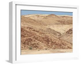 Red Rocky Landscape with Jeep in Distance, Purros Conservancy Wilderness, Kaokoland, Namibia-Kim Walker-Framed Photographic Print