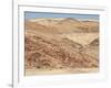 Red Rocky Landscape with Jeep in Distance, Purros Conservancy Wilderness, Kaokoland, Namibia-Kim Walker-Framed Photographic Print