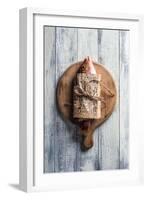 Red Snapper Wrapped in Chinese Newspaper on Wooden Background-Gary Jones-Framed Photographic Print