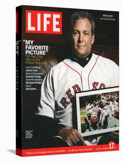 Red Sox Pitcher, Curt Schilling, Holding Photo of 2004 World Series Victory, December 17, 2004-John Huet-Stretched Canvas