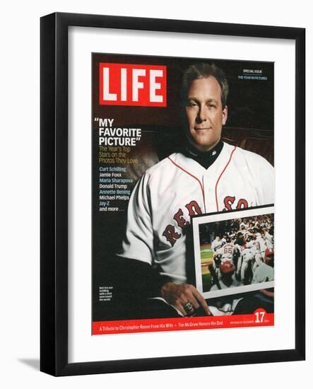 Red Sox Pitcher, Curt Schilling, Holding Photo of 2004 World Series Victory, December 17, 2004-John Huet-Framed Photographic Print