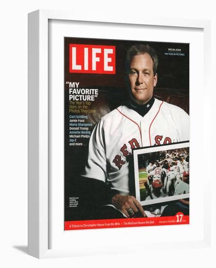 Red Sox Pitcher, Curt Schilling, Holding Photo of 2004 World Series Victory, December 17, 2004-John Huet-Framed Photographic Print