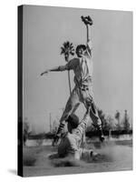 Red Sox's Player in Mid Air Catching the Ball, While an Opposing Player Slides Between His Legs-John Florea-Stretched Canvas