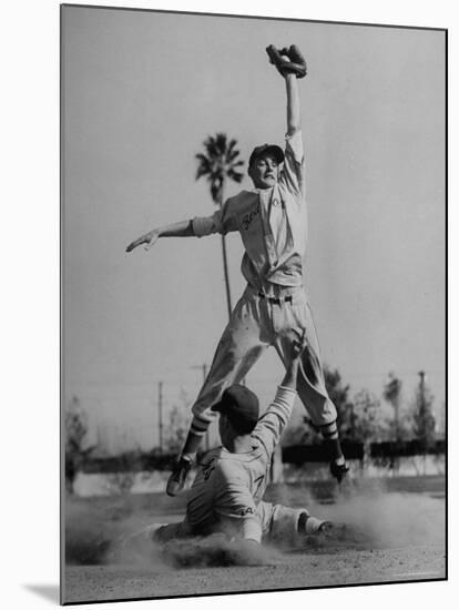 Red Sox's Player in Mid Air Catching the Ball, While an Opposing Player Slides Between His Legs-John Florea-Mounted Premium Photographic Print
