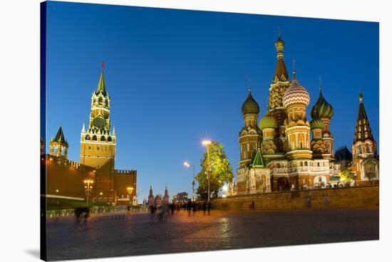 Red Square, St. Basil's Cathedral and the Savior's Tower of the Kremlin lit up at night, UNESCO Wor-Miles Ertman-Stretched Canvas