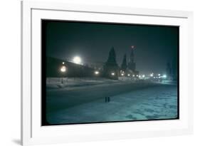 Red Star Atop Kremlin Tower Glowing Against Night-Dim Sky in Snow-Covered, Wintry Moscow, Ussr-Carl Mydans-Framed Photographic Print