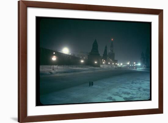 Red Star Atop Kremlin Tower Glowing Against Night-Dim Sky in Snow-Covered, Wintry Moscow, Ussr-Carl Mydans-Framed Photographic Print