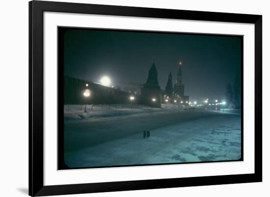 Red Star Atop Kremlin Tower Glowing Against Night-Dim Sky in Snow-Covered, Wintry Moscow, Ussr-Carl Mydans-Framed Photographic Print