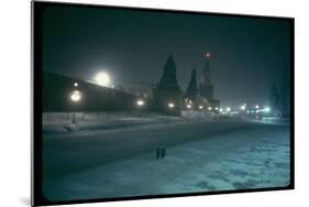 Red Star Atop Kremlin Tower Glowing Against Night-Dim Sky in Snow-Covered, Wintry Moscow, Ussr-Carl Mydans-Mounted Photographic Print