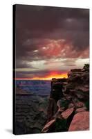 Red sunset with moody clouds and red rock canyons in Dead Horse Point State Park near Moab, Utah-David Chang-Stretched Canvas