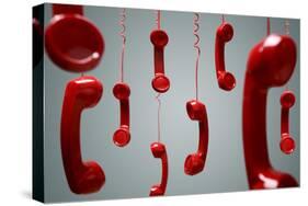 Red Telephone Receiver Hanging-Brian Jackson-Stretched Canvas